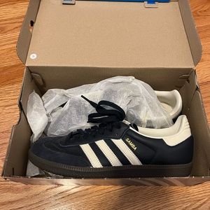 Navy blue adidas sambas